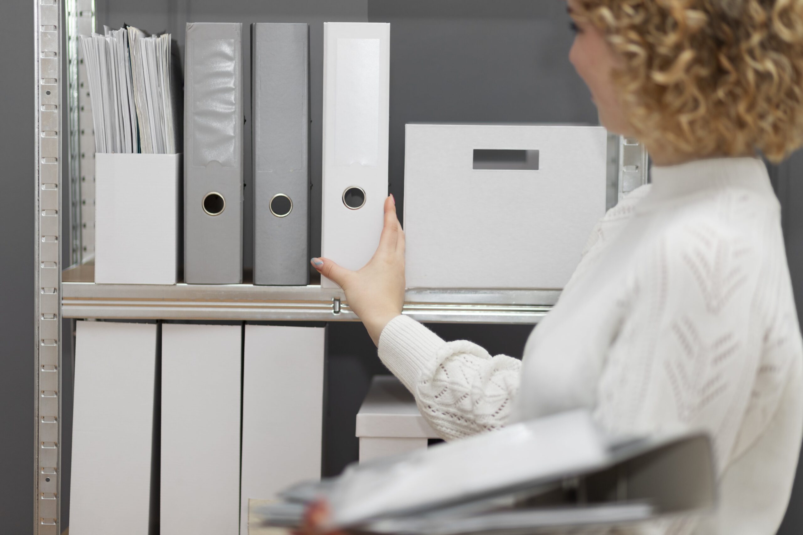 young-adult-organizing-documents-2-min