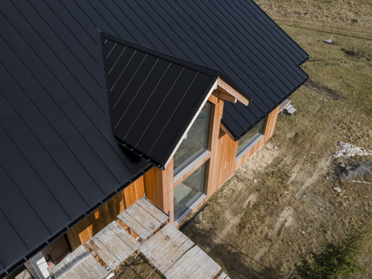 high-angle-beautiful-wooden-house-with-new-roof
